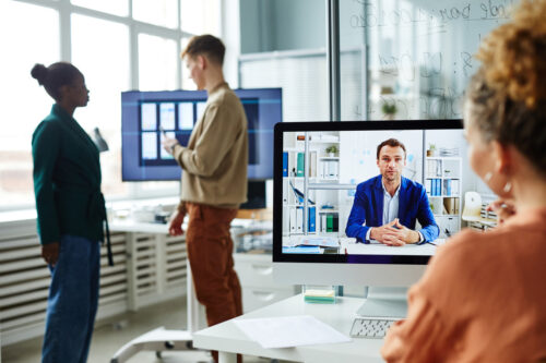 Woman in an office has a video call with virtual CIO